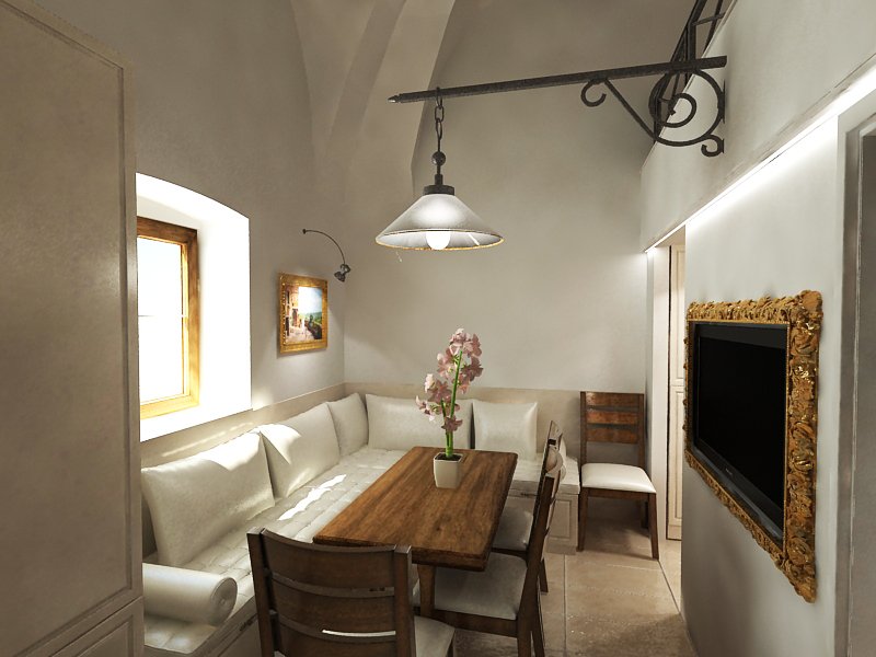 Salon w małym mieszkaniu, długi stół przeznaczony do jedzenia posiłków oraz narożnikowa kanapa przeznaczona do relaksu. wbudowany telewizor